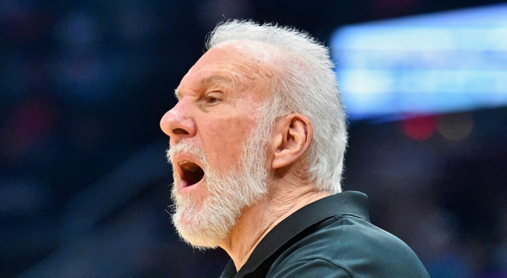 San Antonio Spurs' head coach Gregg Popovich yelling to players during game.