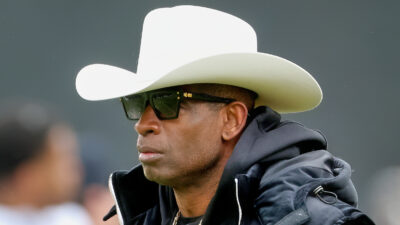 Deion Sanders in cowboy hat and sunglasses