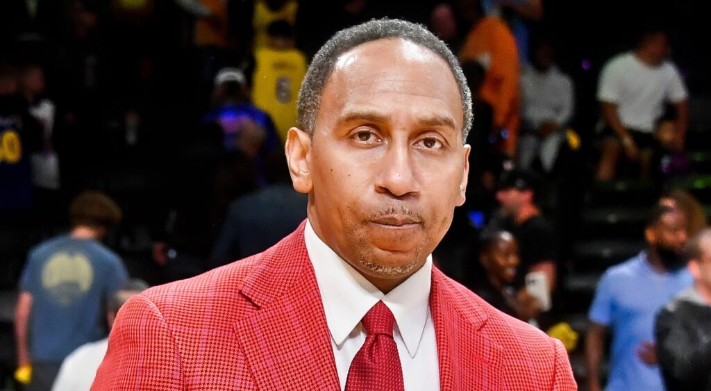 ESPN commentator Stephen A. Smith looking on.