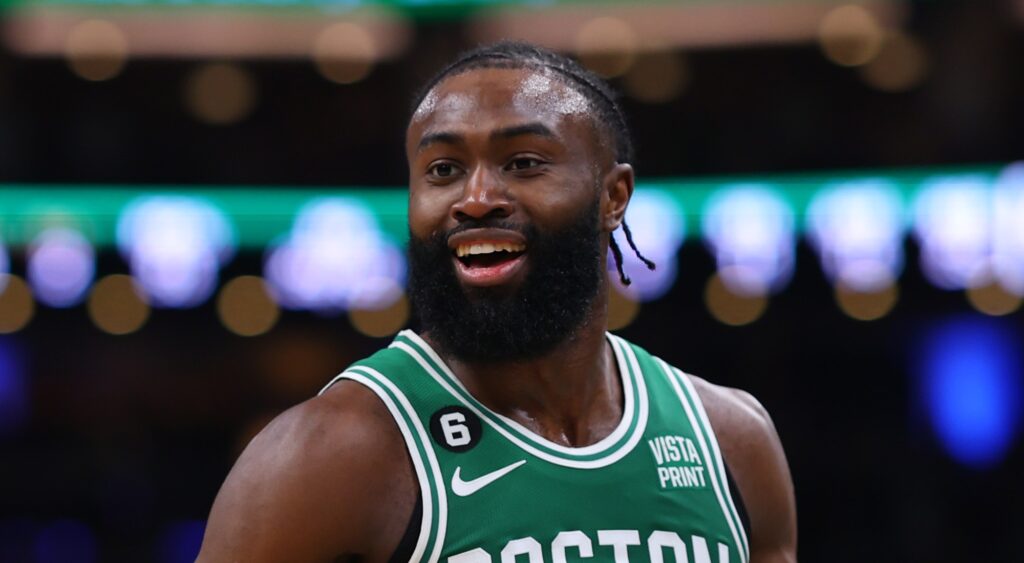 Boston Celtics' star Jaylen Brown looking on during game.
