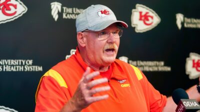 Andy Reid at press conference in Chiefs gear