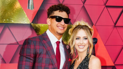 Patrick Mahomes and his wife smiling for a photo