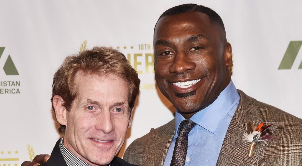 Skip Bayless (left) smiling with Shannon Sharpe (right).