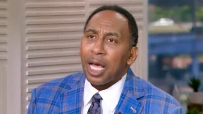 Stephen A. Smith in blue suit on espn set