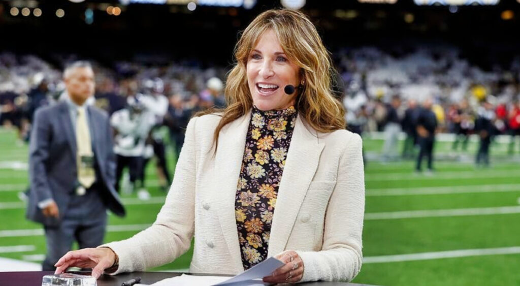 Suzy Kolber reportign from sideline at football game