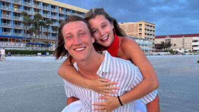Trevor Lawrence carrying his wife on his back