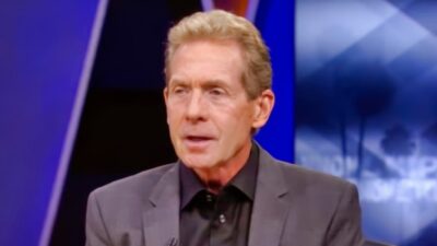 Skip Bayless on set in suit