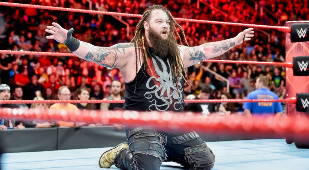 Bray Wyatt kneeling in wrestling ring