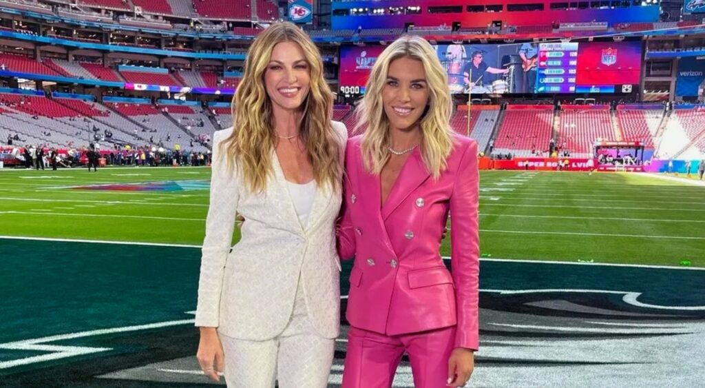 Erin Andrews and Charissa Thompson posing at football game