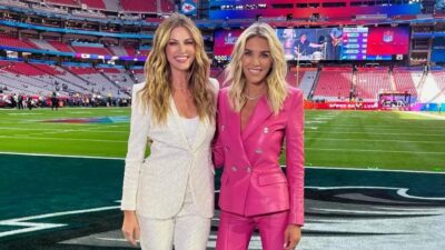 Erin Andrews and Charissa Thompson posing at football game
