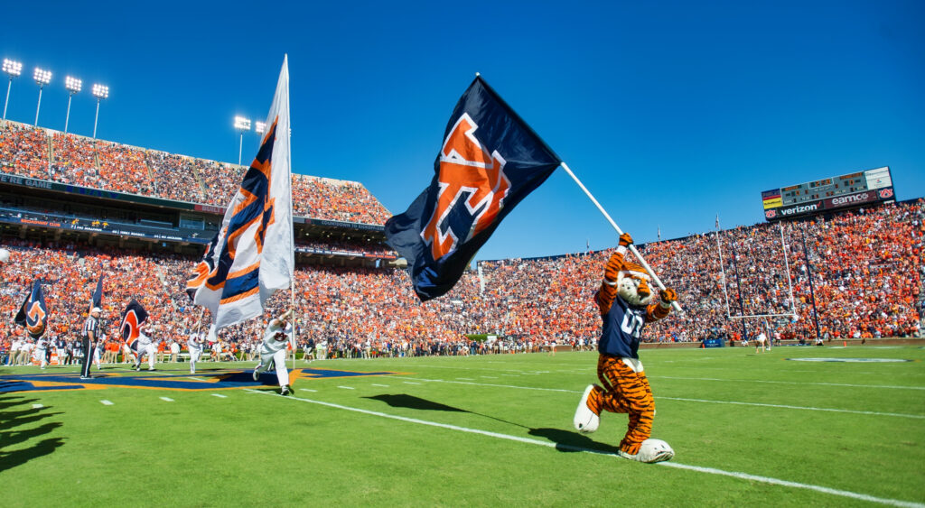 Auburn Tigers mascot with flag.