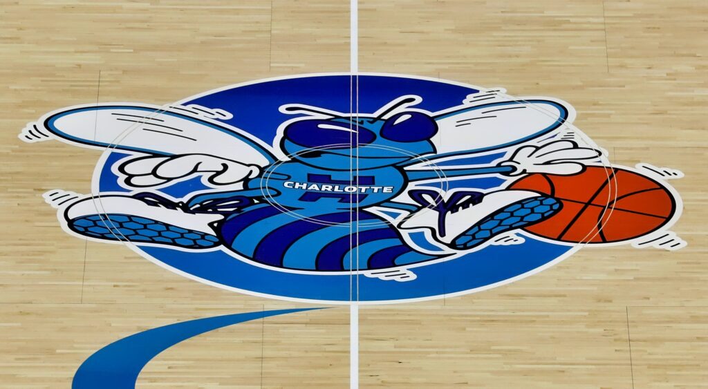 Charlotte Hornets logo at center court.