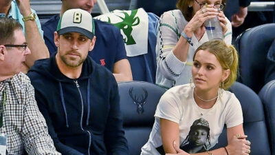 Aaron Rodgers sitting next to Mallory Edens