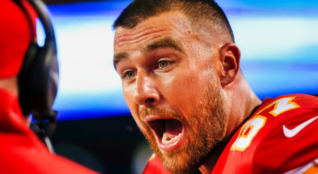 Travis Kelce yelling on the bench.