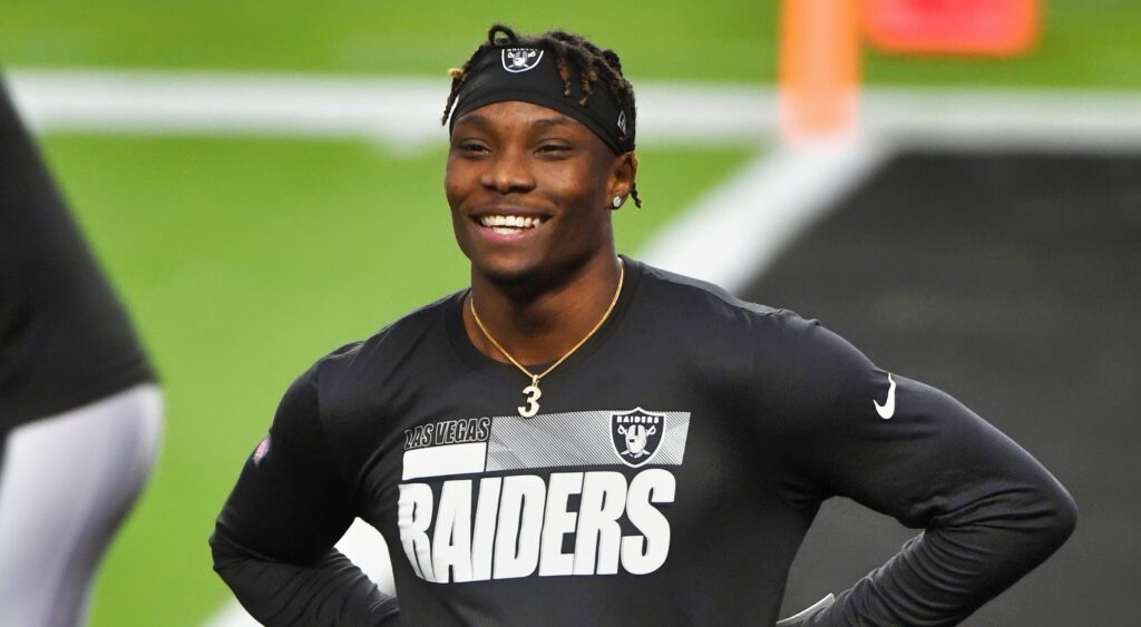 Henry Ruggs smiling with Raiders gear on