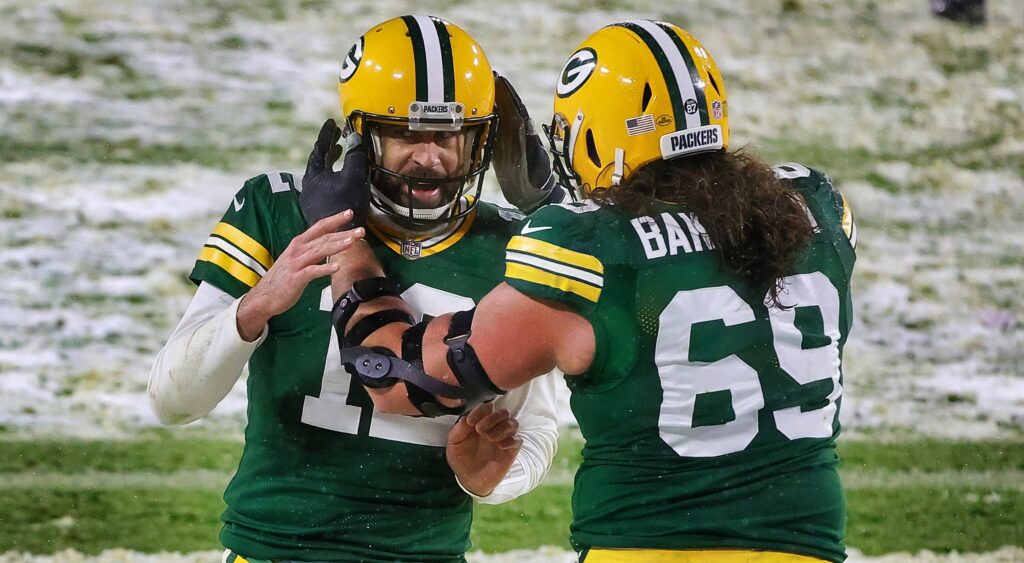 David Bakhtiari and Aaron Rodgers embracing each other