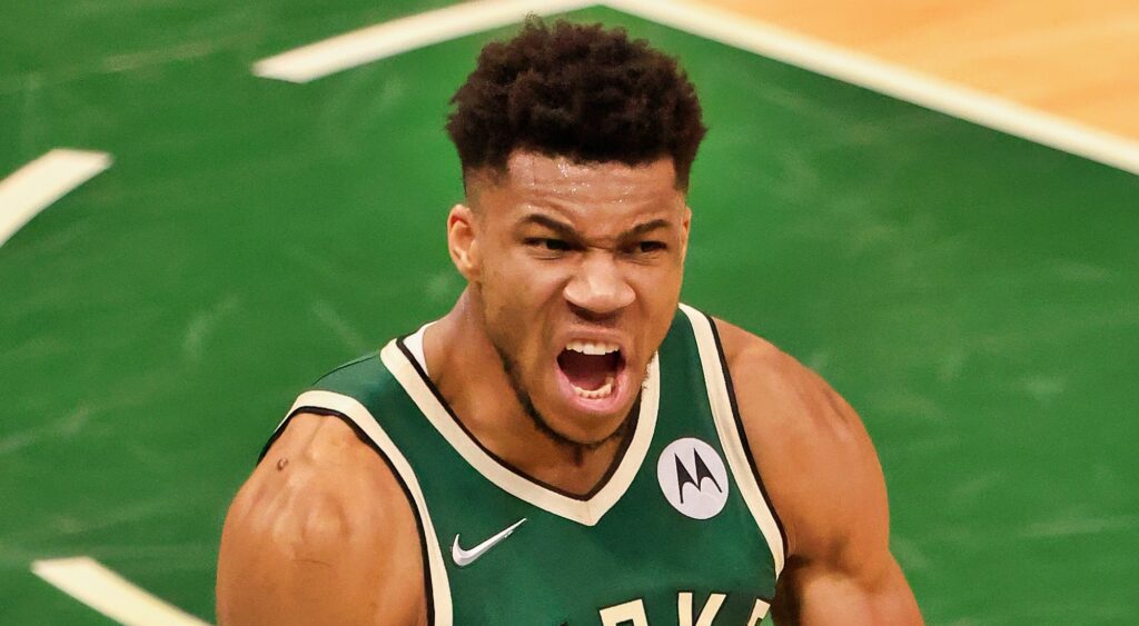 Giannis Antetokounmpo screams after a play.