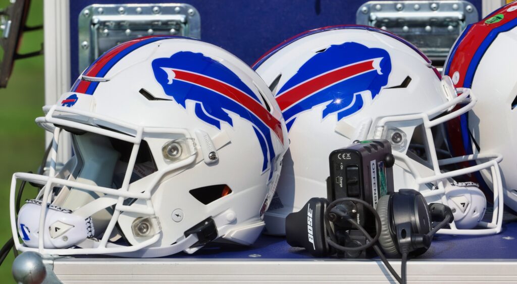 Two Buffalo BIlls helmets on the bench.