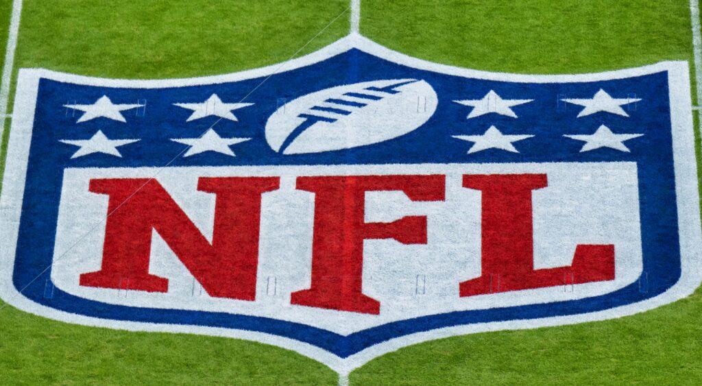 NFL logo on the field.