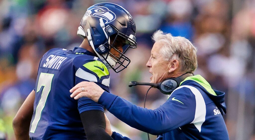 Geno Smith (left) and Pete Carroll (right) of Seattle Seahawks celebrating touchdown.
