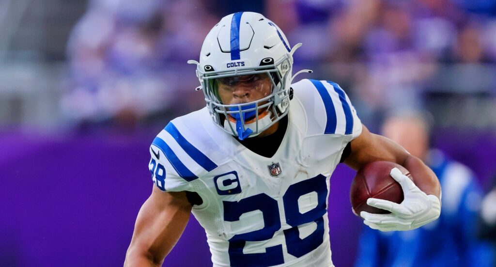 Indianapolis Colts' RB Jonathan Taylor running with football.