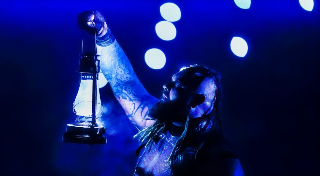 Bray Wyatt holding up lantern at 2023 WWE Royal Rumble.