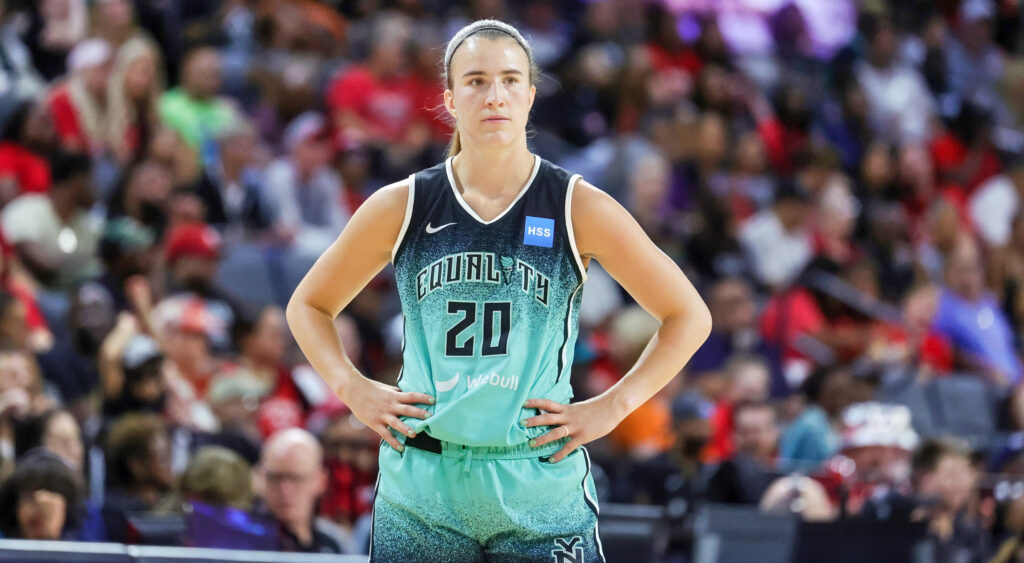 Sabrina Ionescu standing with her hands on her waist