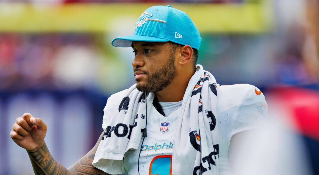 Tua in Dolphins jersey and cap