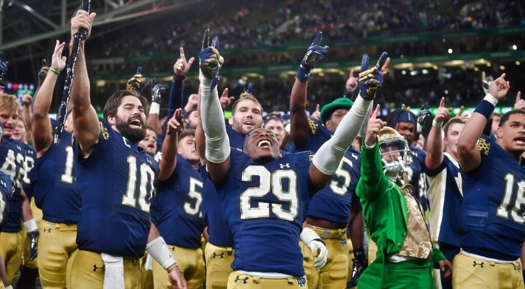 Notre Dame players celebrate a win over Navy.