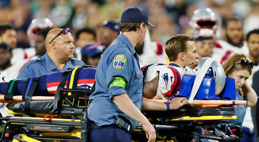 Isaiah Bolden of New England Patriots being carted off.