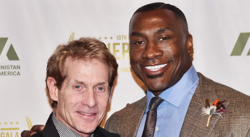 Skip Bayless (left) and Shannon Sharpe (right) smiling at event.