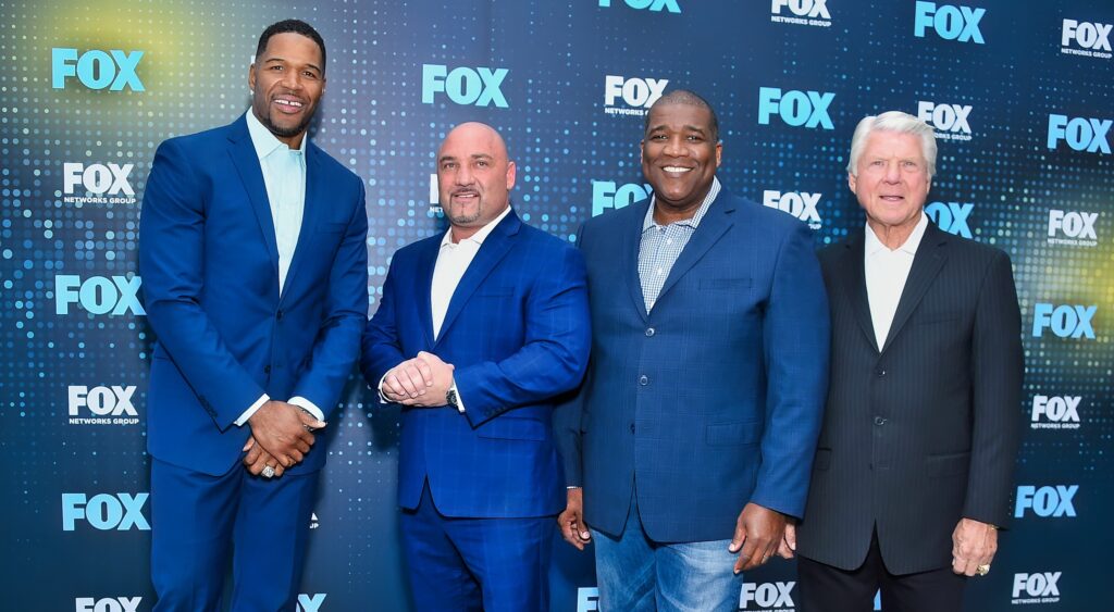 (Left to right): Michael Strahan, Jay Glazer, Curt Menefee and Jimmy Johnson at Wollman Rink.