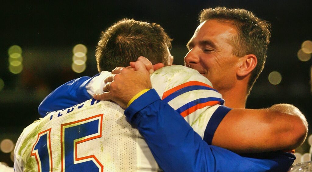 Tim Tebow and Urban Meyer hug after winning the national championship at Florida.