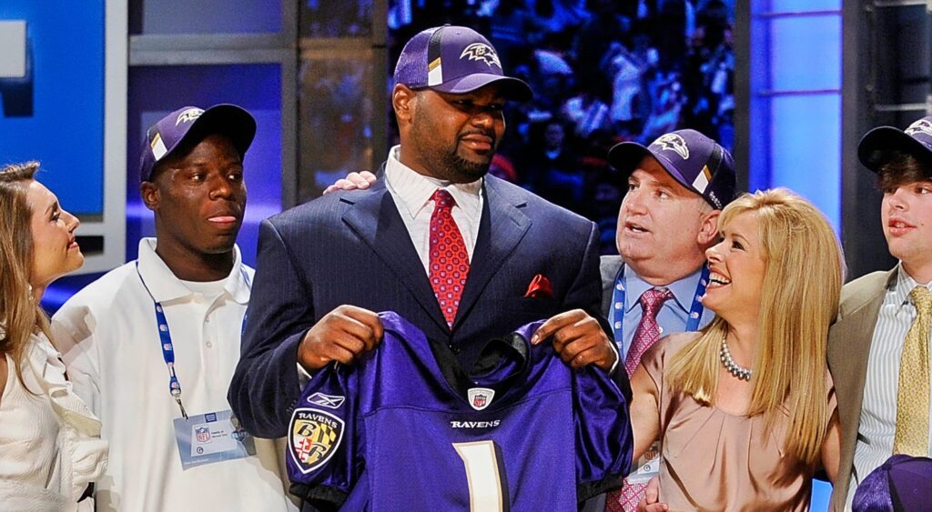 Michael Oher and the Tuohy Family pose for a photo after he was drafted to the NFL.