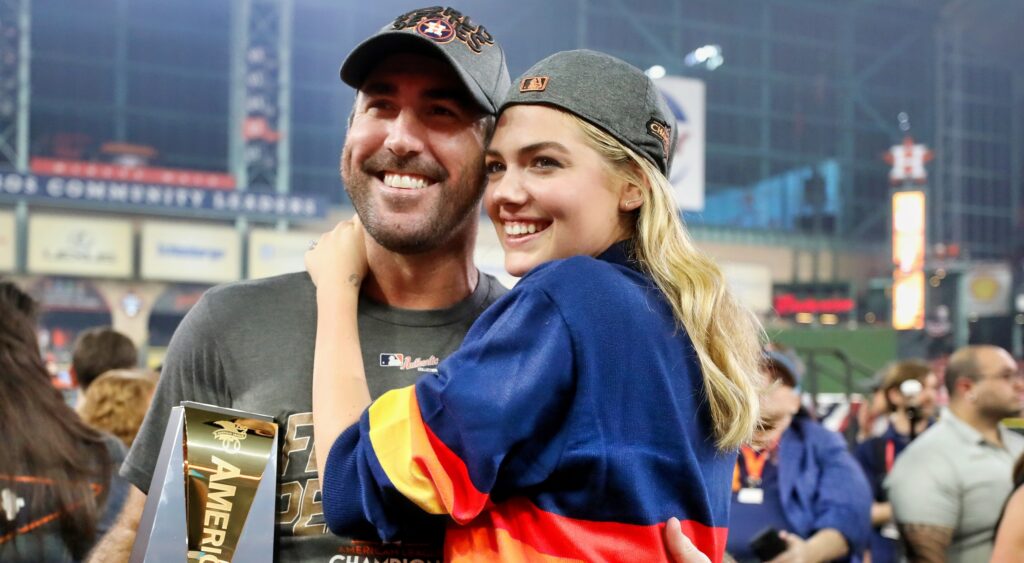Justin Verlander and Kate Upton pose for the camera after winning the ALCS.