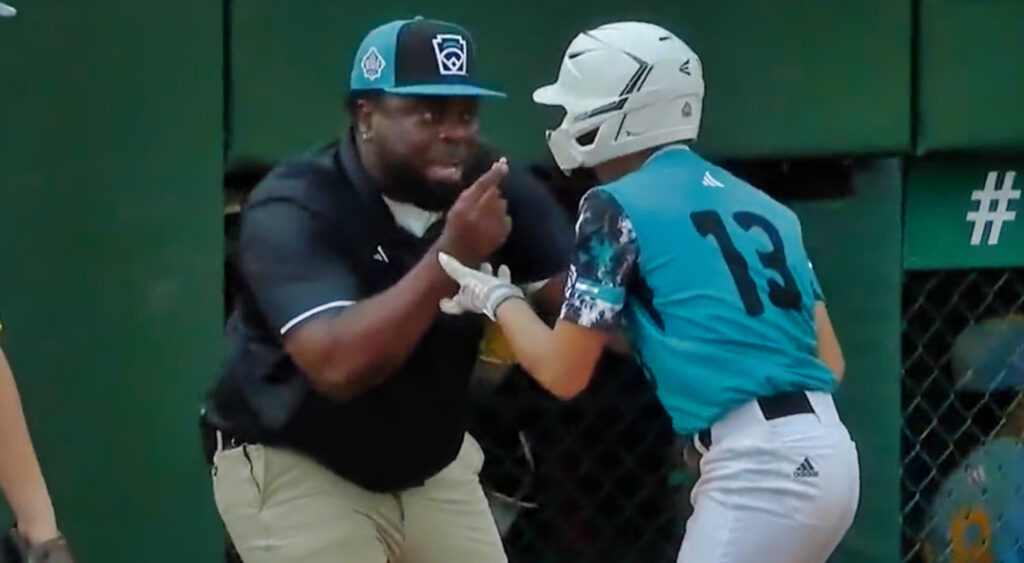 Curacao coach with player during LLWS