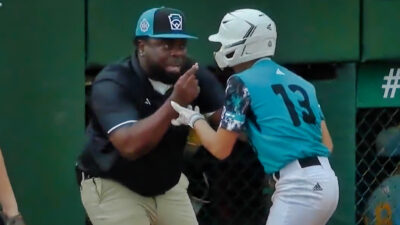 Curacao coach with player during LLWS