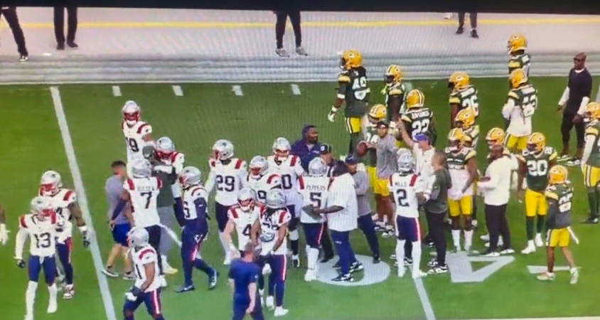New England Patriots and Green Bay Packers players being separated.