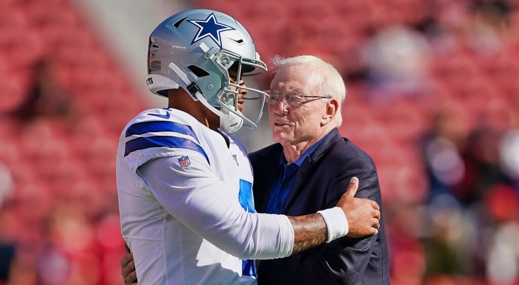 Quarterback Dak Prescott (left) meeting with Dallas Cowboys' owner Jerry Jones (right).