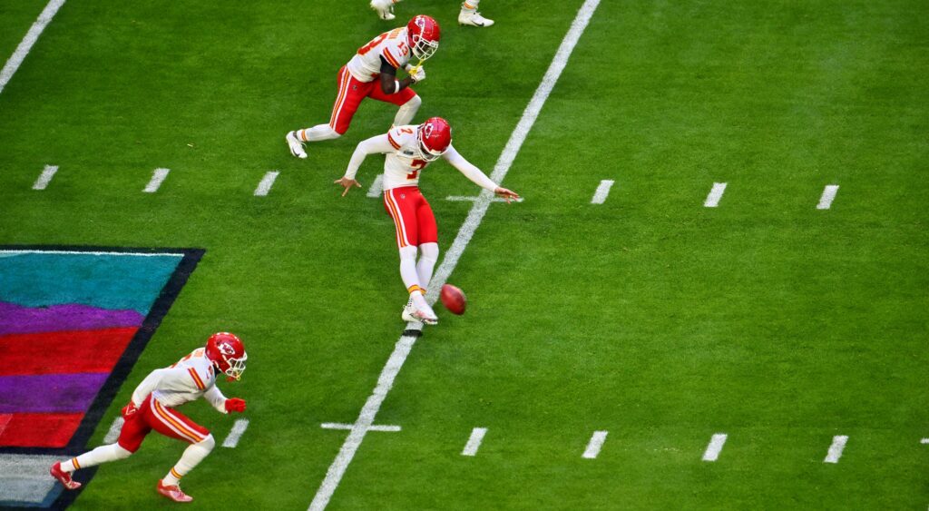 Chiefs player kicking football