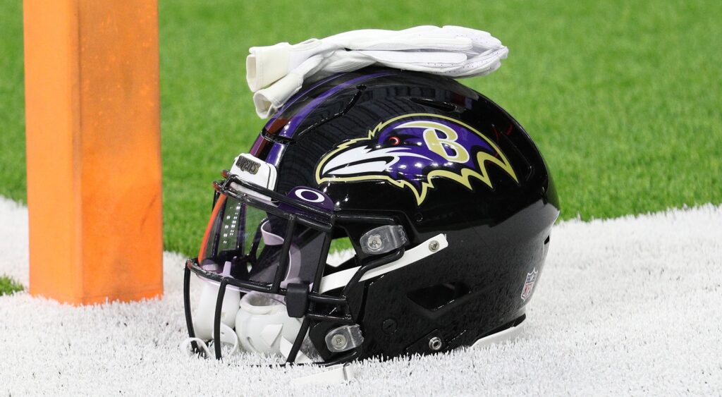 Baltimore Ravens' helmet shown on field.
