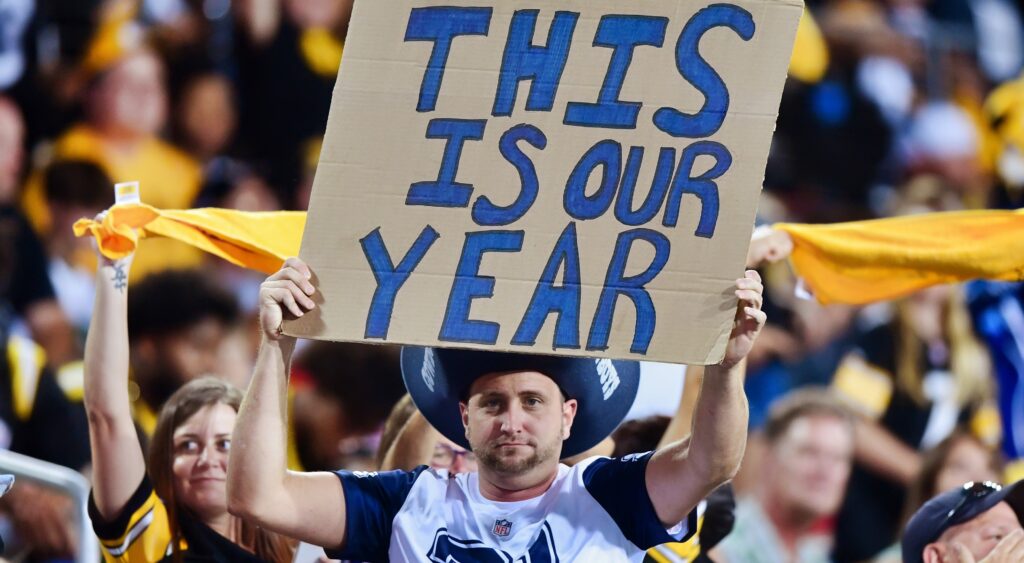 Cowboys fan holds up a sign that reads "this is our year."