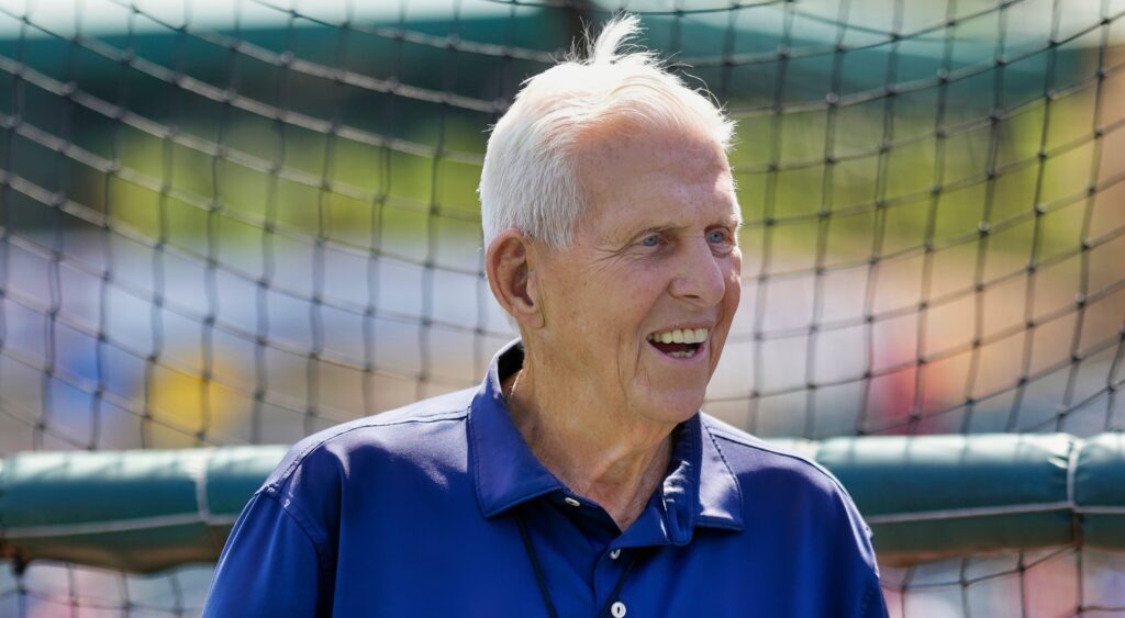 Former NFL coach Bill Parcells smiling at Mets' practice.