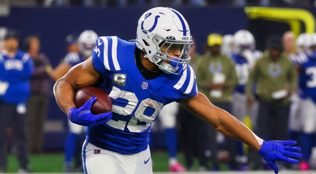 Indianapolis Colts' RB Jonathan Taylor running with football.