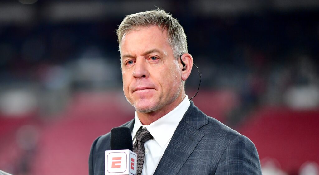Troy Aikman of ESPN looking on.