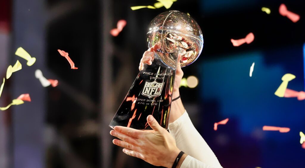Lombardi Trophy being held up.