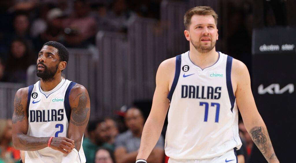 Kyrie Irving (left) and Luka Doncic (right) of Dallas Mavericks look on during game.
