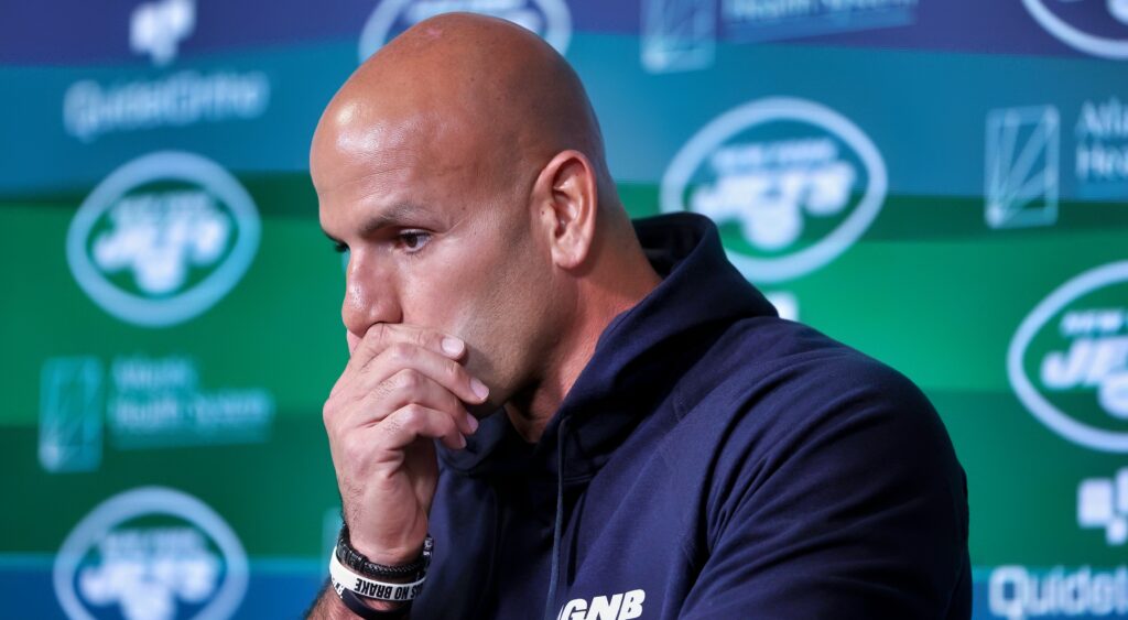 Robert Saleh with his hand over his mouth.