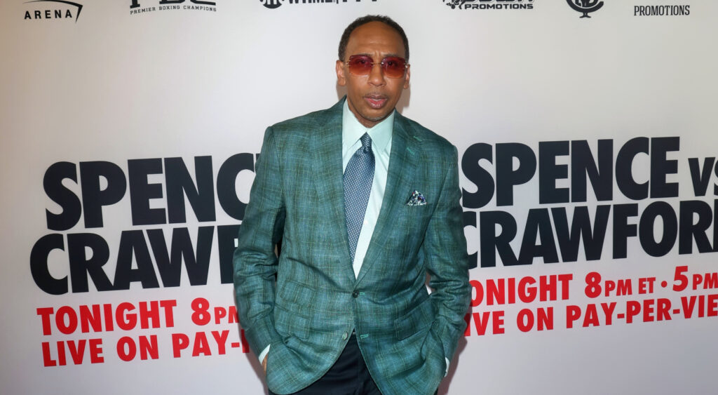 Stephen A. Smith in suit and sunglasses