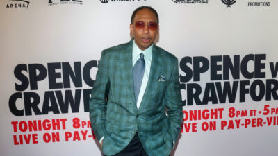 Stephen A. Smith in suit and sunglasses